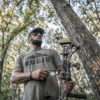 man in the woods wearing rugid t-shirt