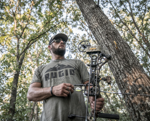 man in the woods wearing rugid t-shirt