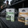 rugid single use repellent and sunscreen foil packs in a car boot